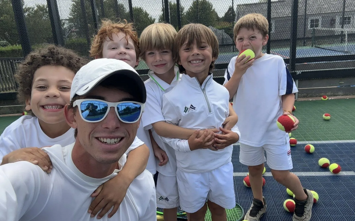 Coach Tom with a junior tennis group in Tampa